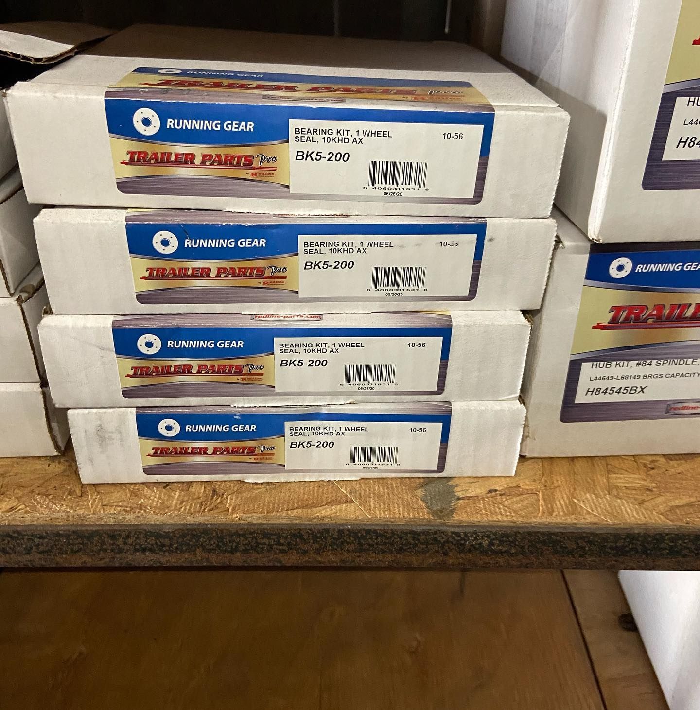 Boxes of trailer parts are stacked on top of each other