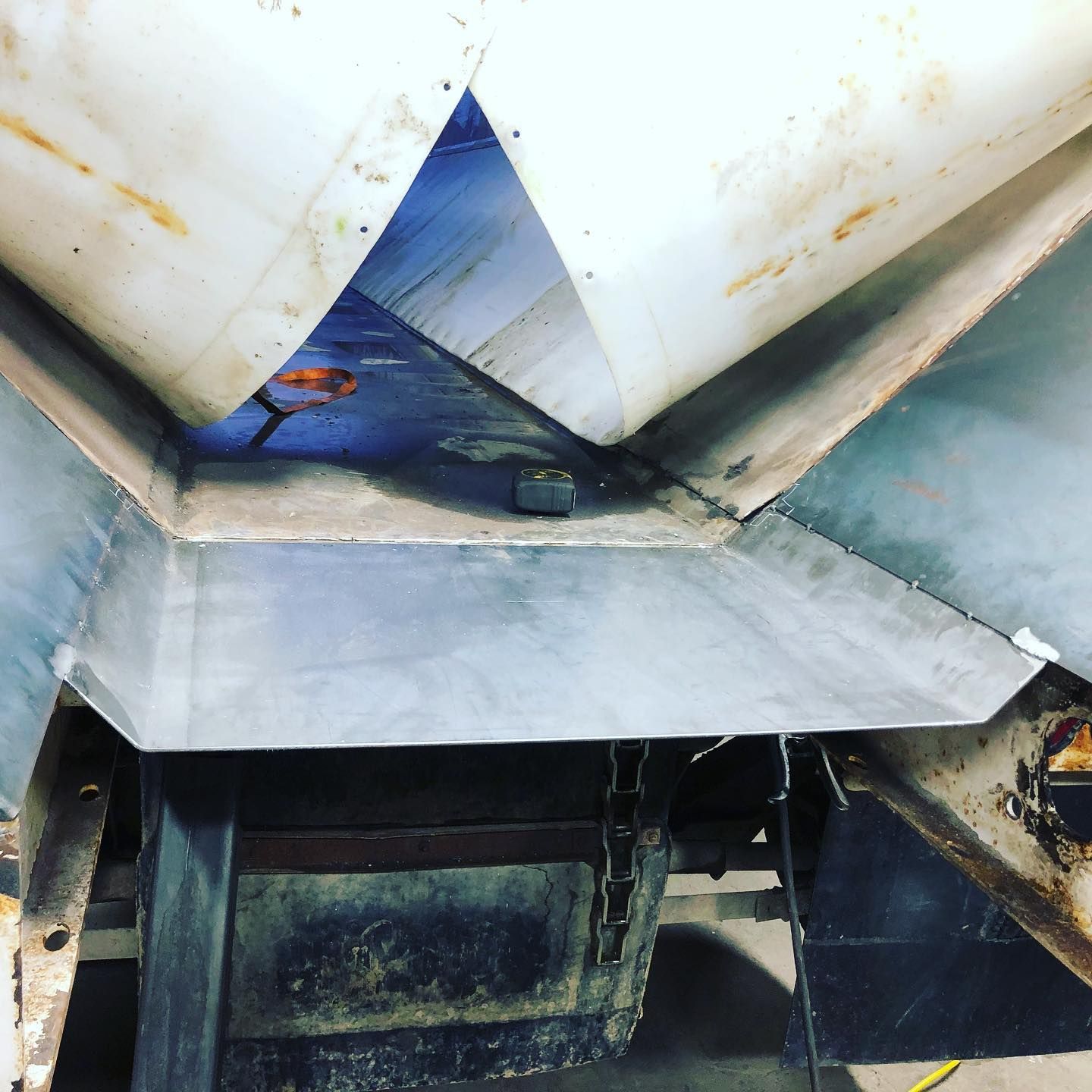 A close up of a metal structure with a blue sky in the background