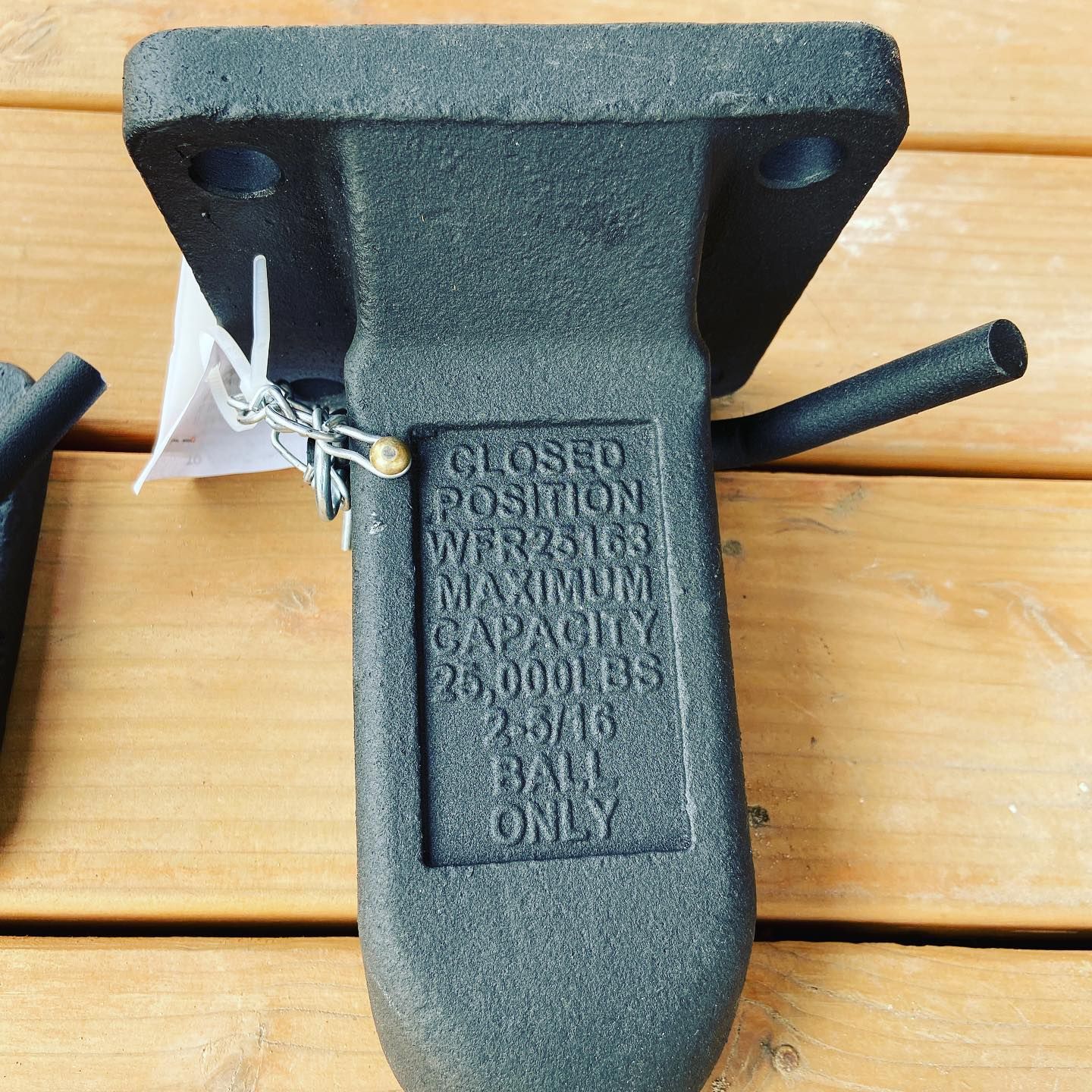 A piece of metal that says closed position on it