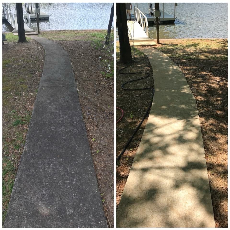 Sidewalk repair before and after, with a dark cracked path beside a smoother light concrete walkway.