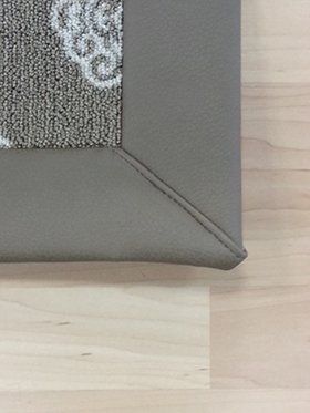 Leather rug binding