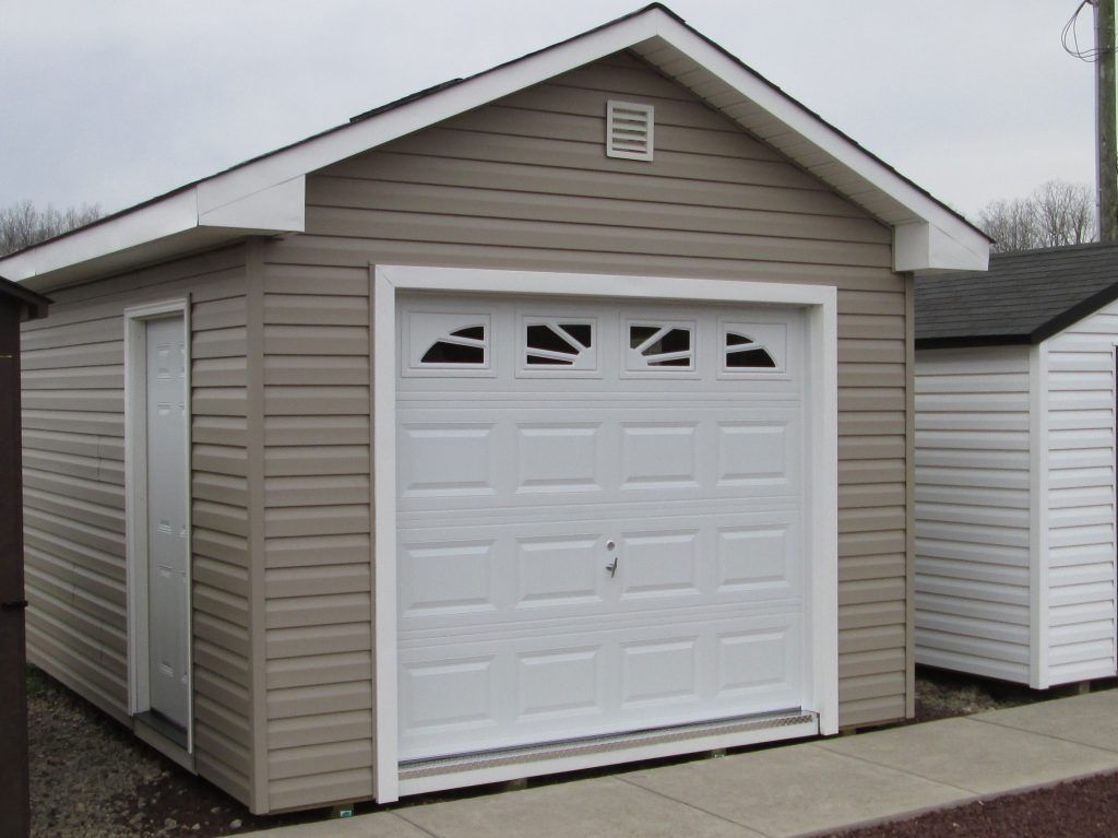 A small garage with a white garage door