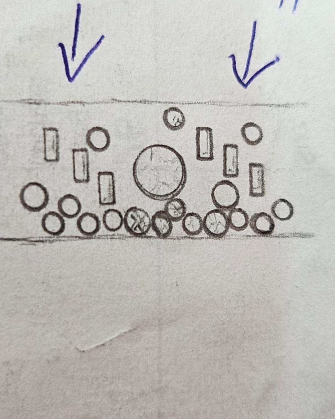 Diagram of a crown design with circles, rectangles, and arrows pointing down.
