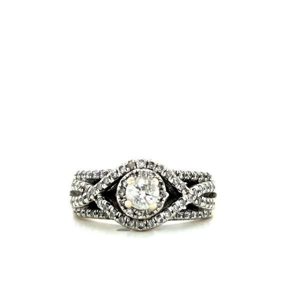 Diamond engagement ring with a center stone and halo, set in a twisted band with additional diamonds.