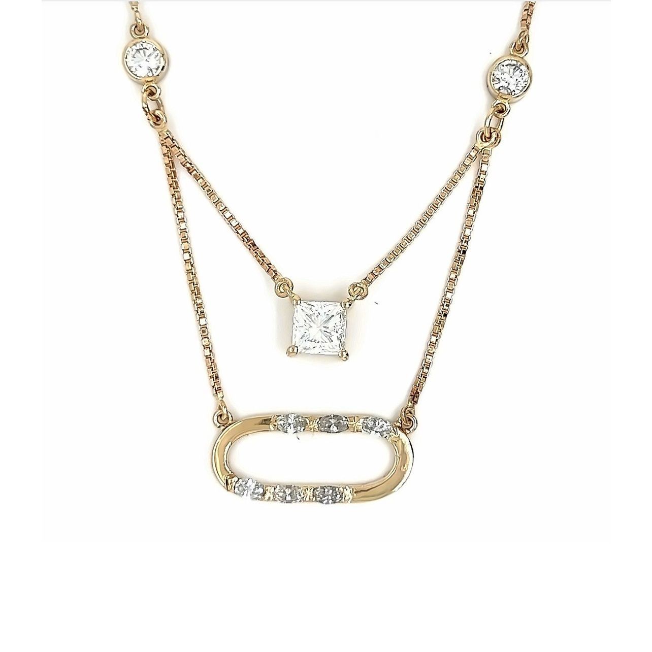 Gold necklace with diamond accents, featuring a square-cut pendant and an oval-shaped charm.