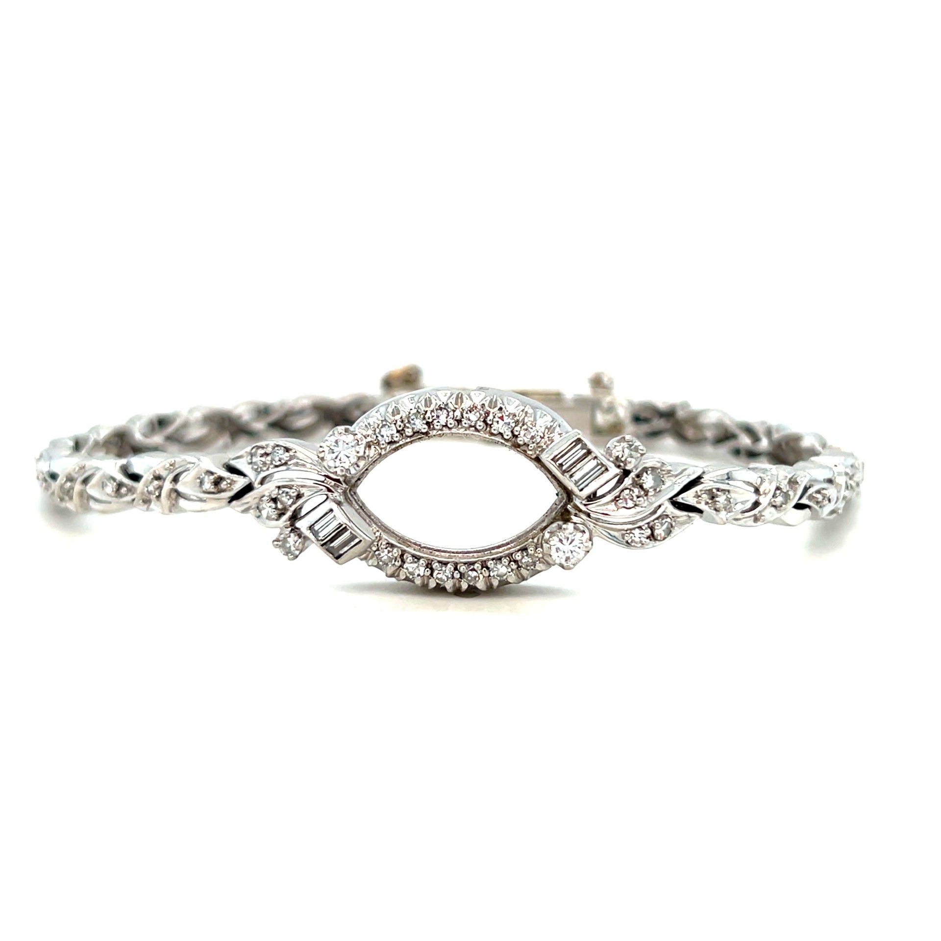 Diamond bracelet with an oval center and chain links.