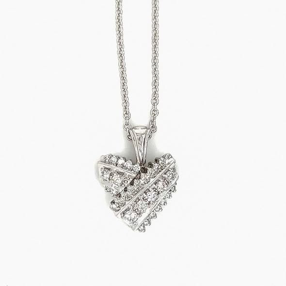 Silver heart pendant necklace with diamonds on a white background.