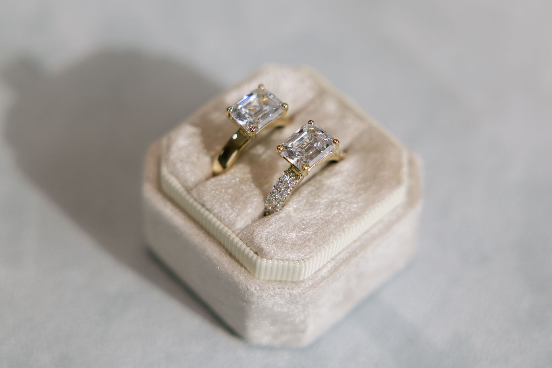 Two rings are sitting on top of each other in a box.