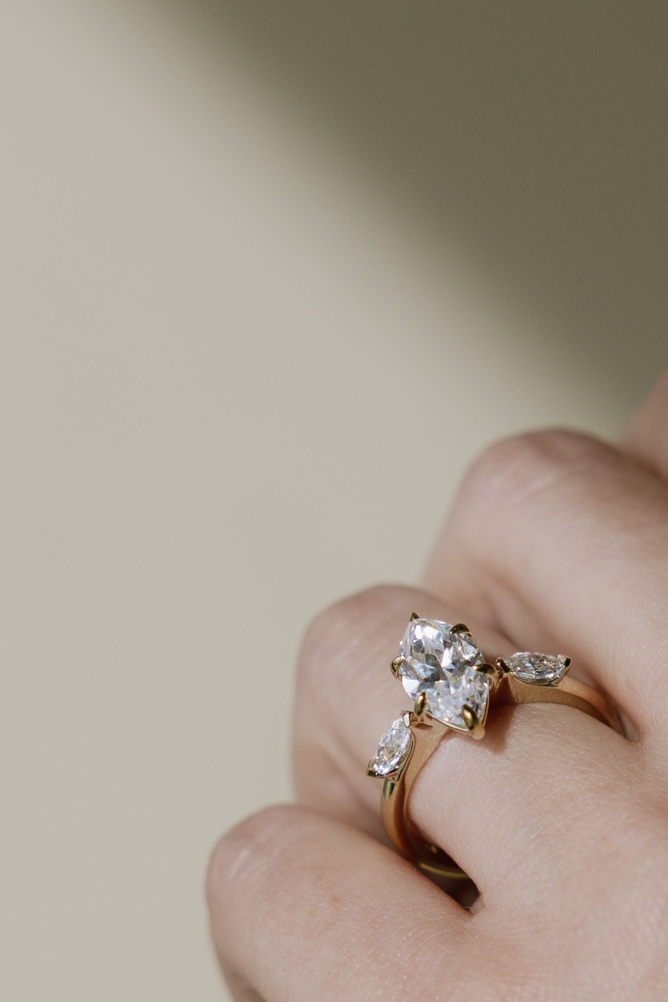 A close up of a person wearing a ring on their finger.