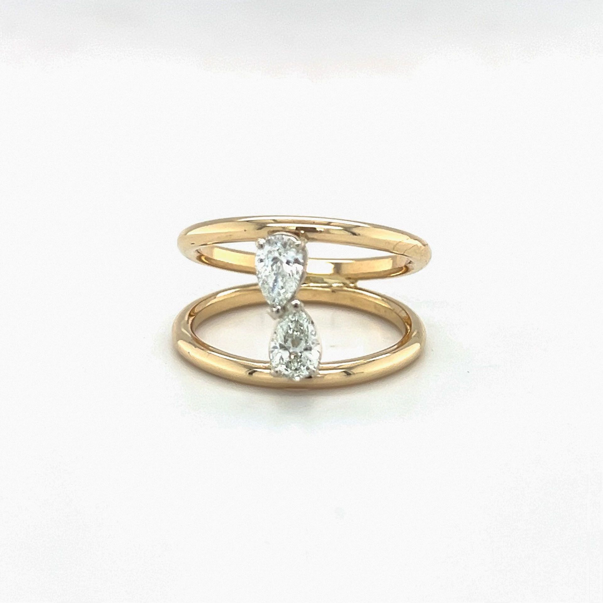 Gold ring with two pear-shaped diamonds