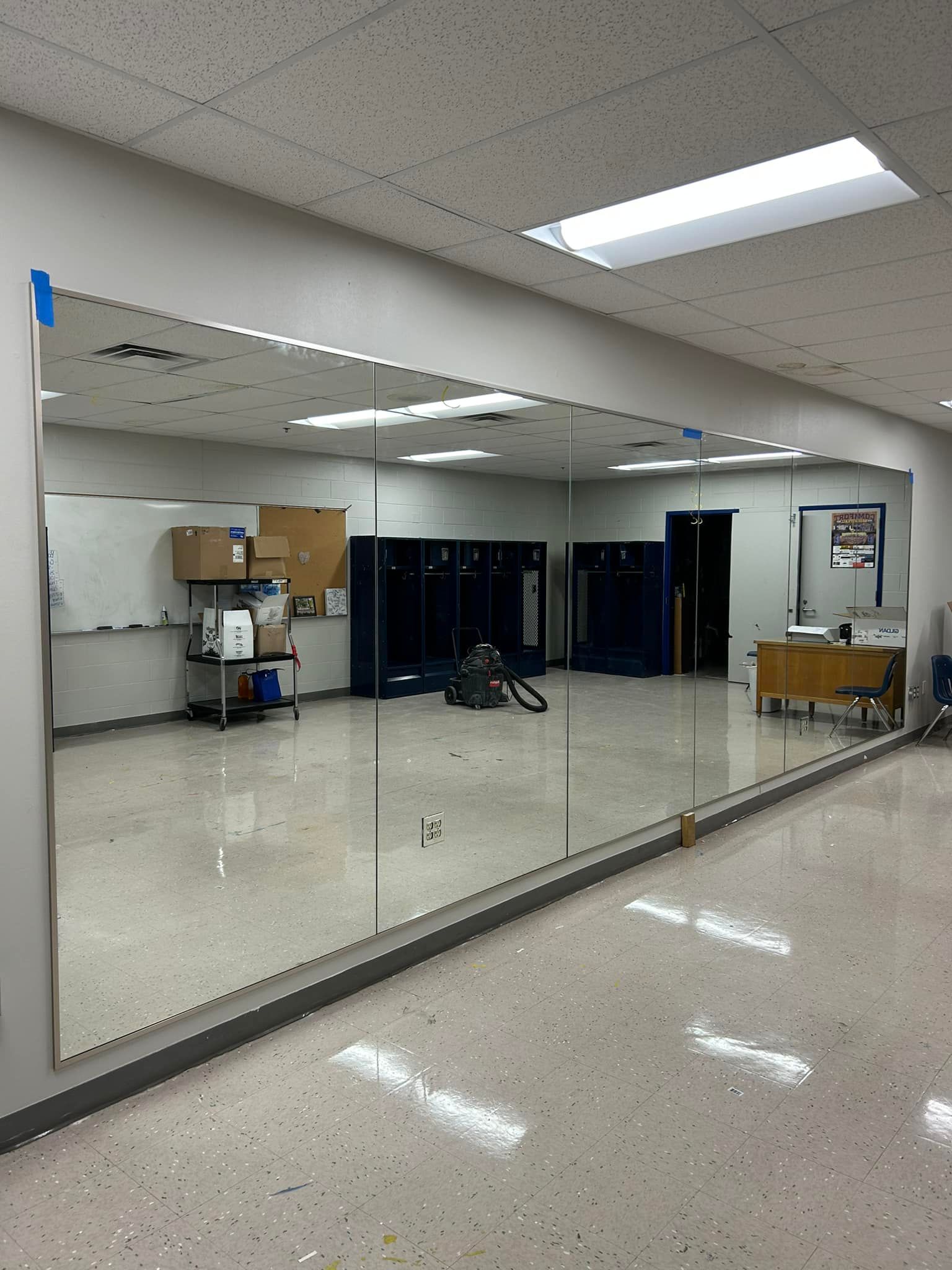 There is a large mirror in the middle of the room.