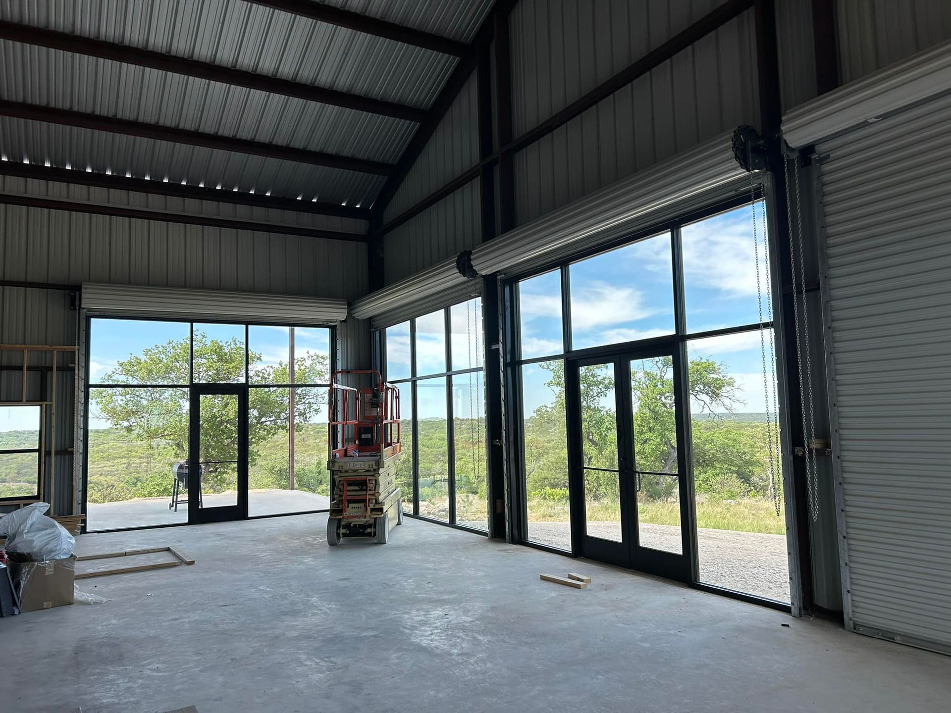 A large room with a lot of windows and doors