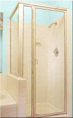 A bathroom with a shower stall and a bathtub.