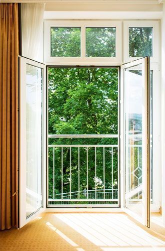 A view of a living room through a glass door.