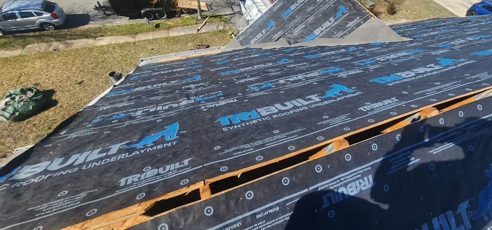 An aerial view of a roof with a lot of shingles on it.