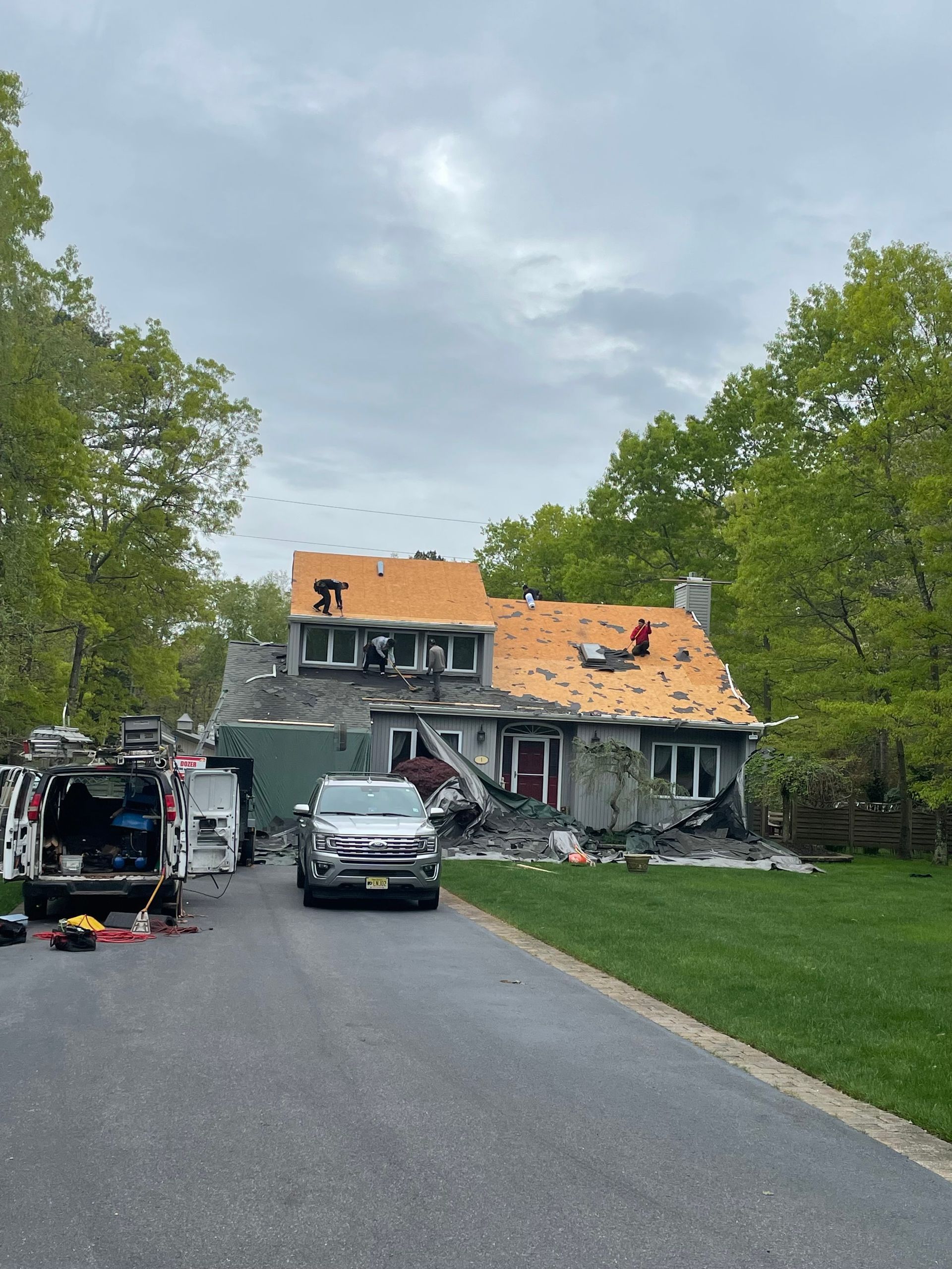 A house is being remodeled with a new roof.