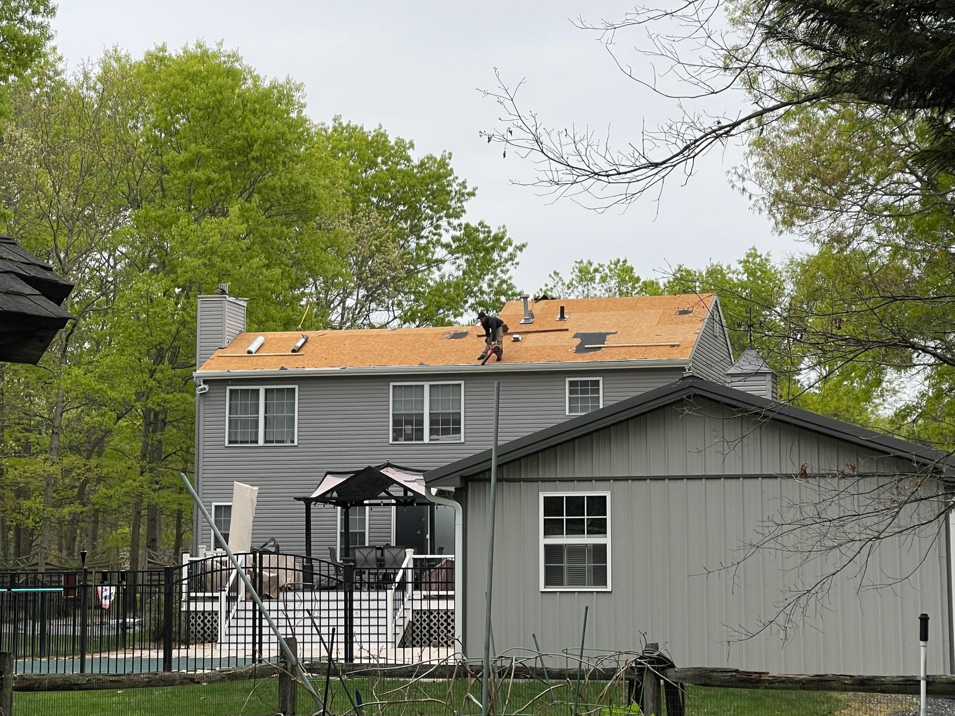 A house with a roof that is being repaired