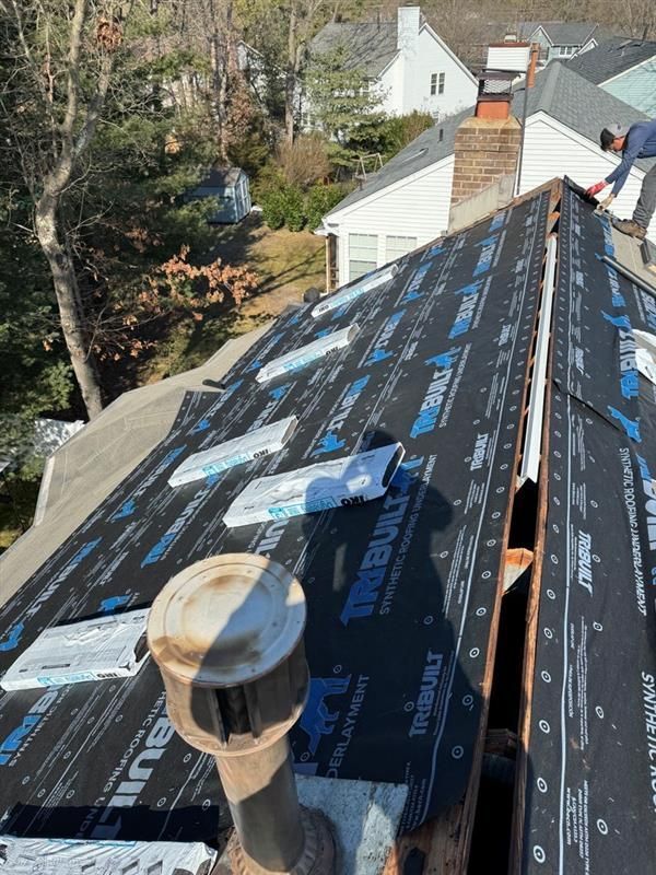 A roof with a chimney on top of it.