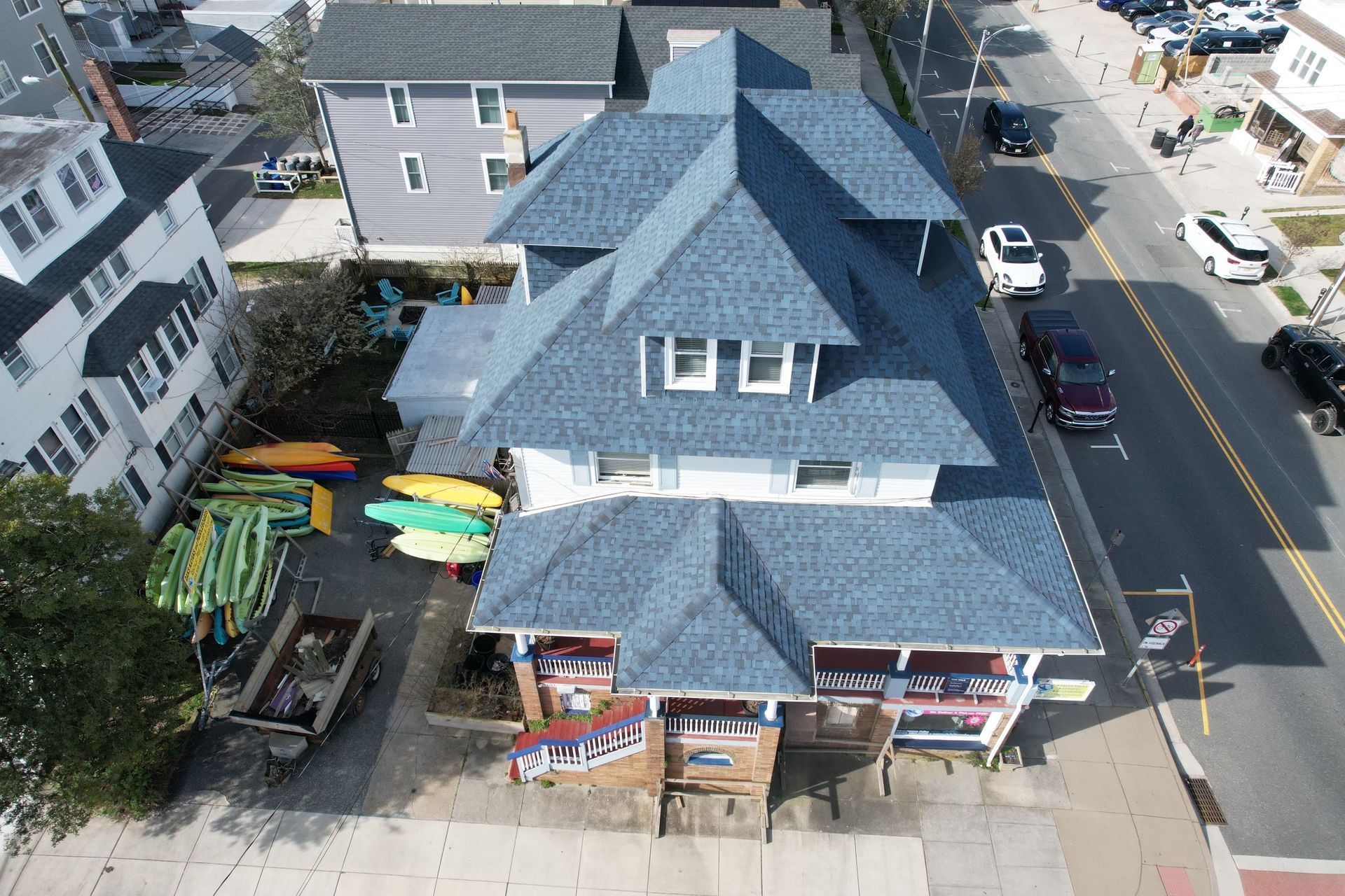An aerial view of a building with a blue roof