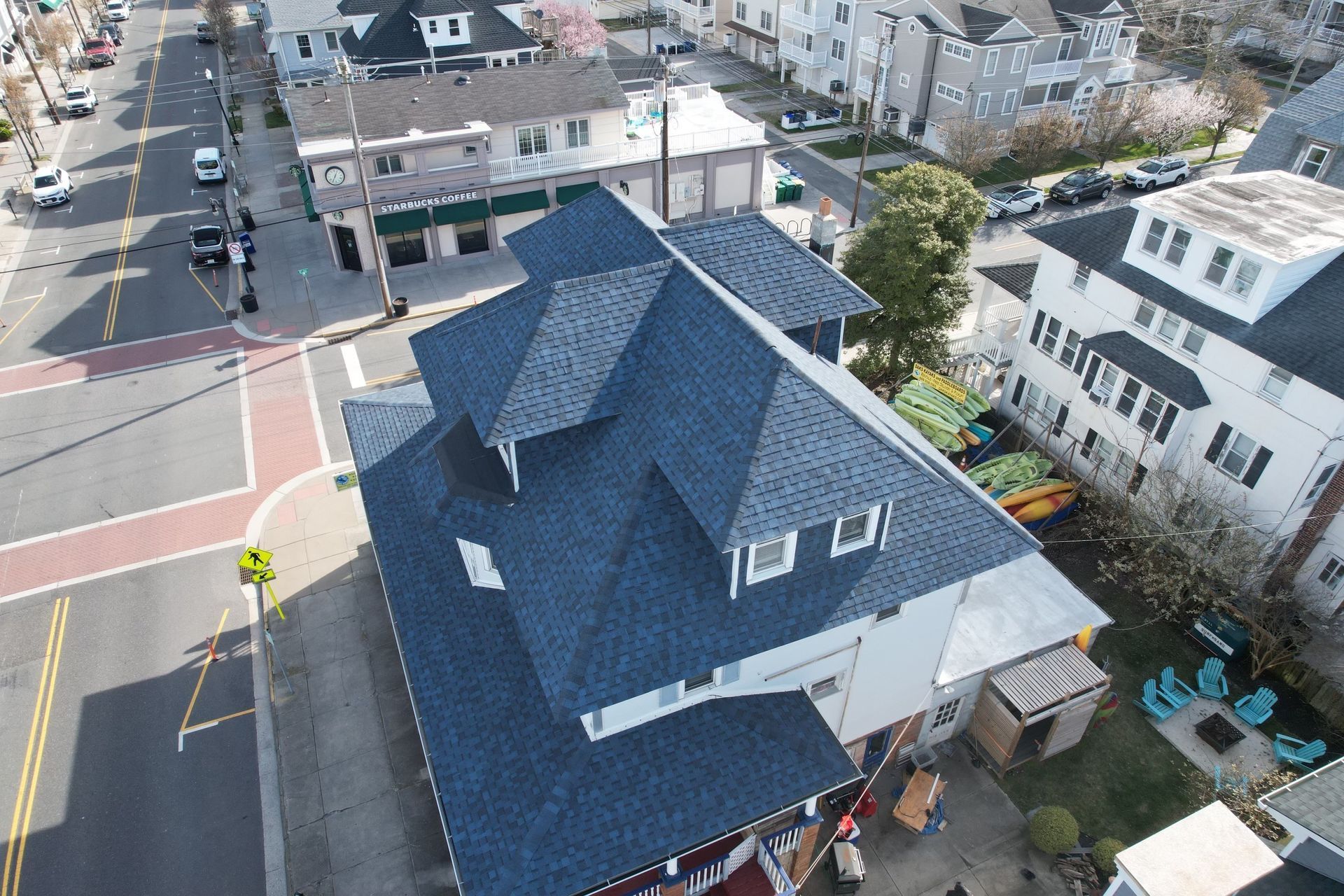 An aerial view of a building with a blue roof