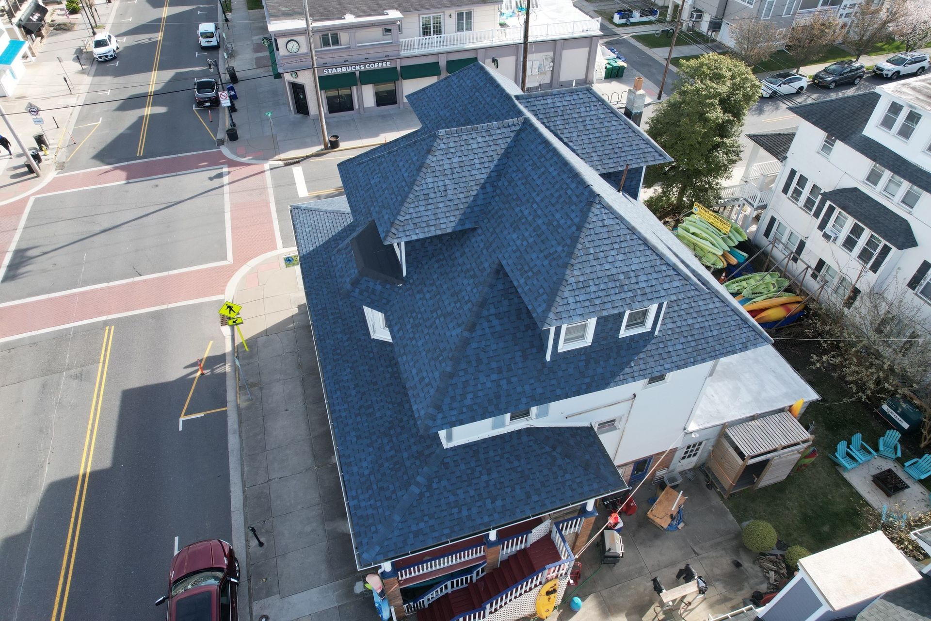 An aerial view of a building with a blue roof.