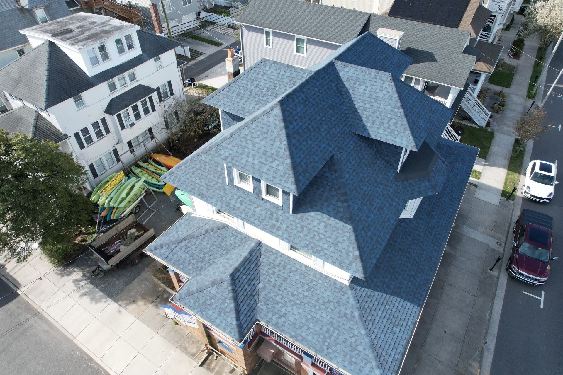 An aerial view of a house with a blue roof.