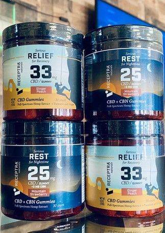 Four stacked CBD lotion jars labeled Relief and Rest in blue and orange packaging