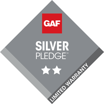 A silver pledge limited warranty badge with two stars
