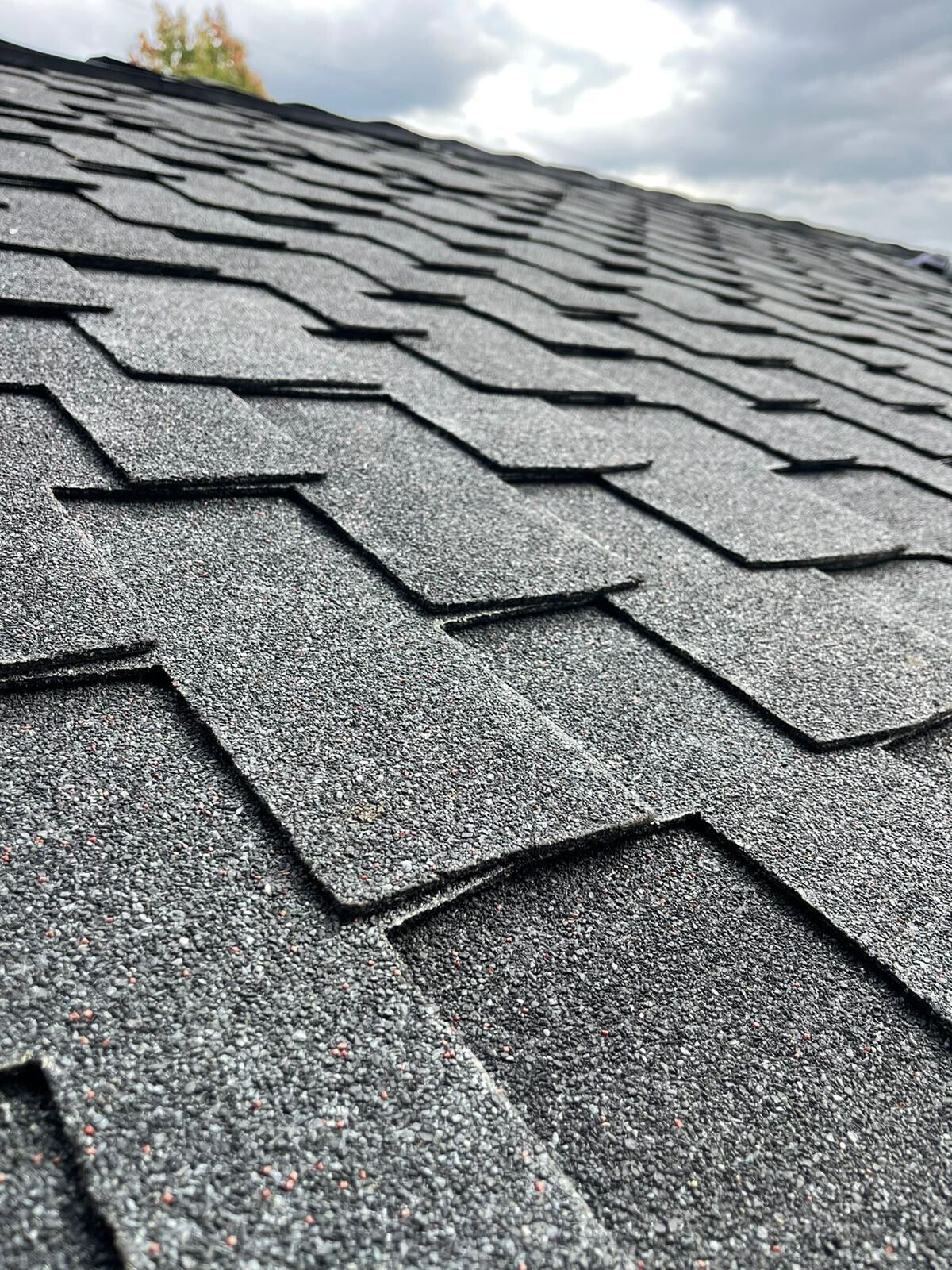 A close up of a roof with shingles on it.