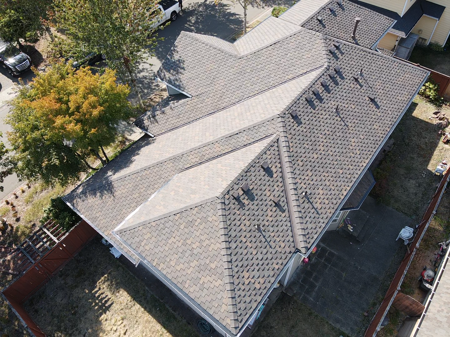 An aerial view of a house with a gray roof.