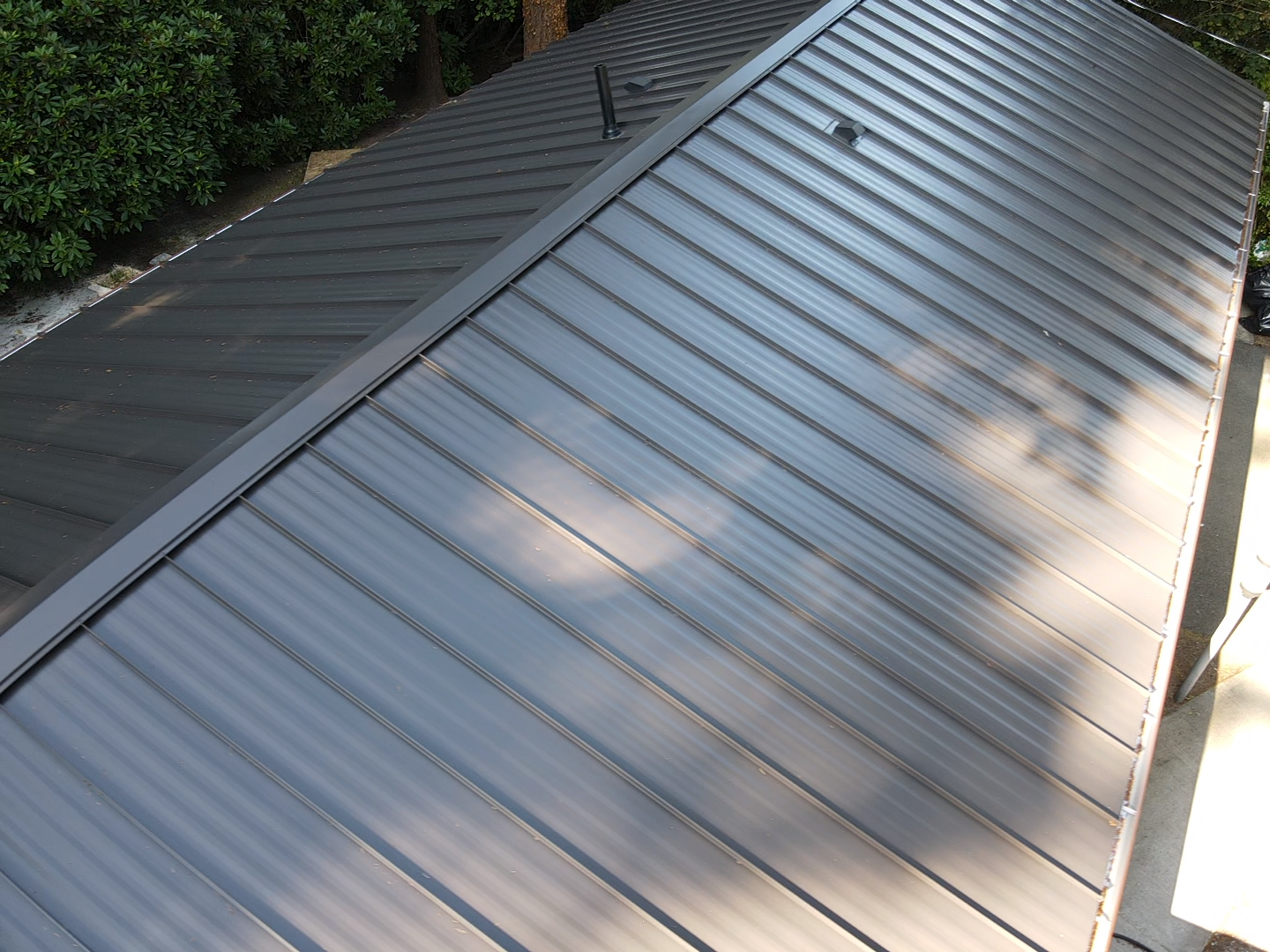 An aerial view of a black metal roof