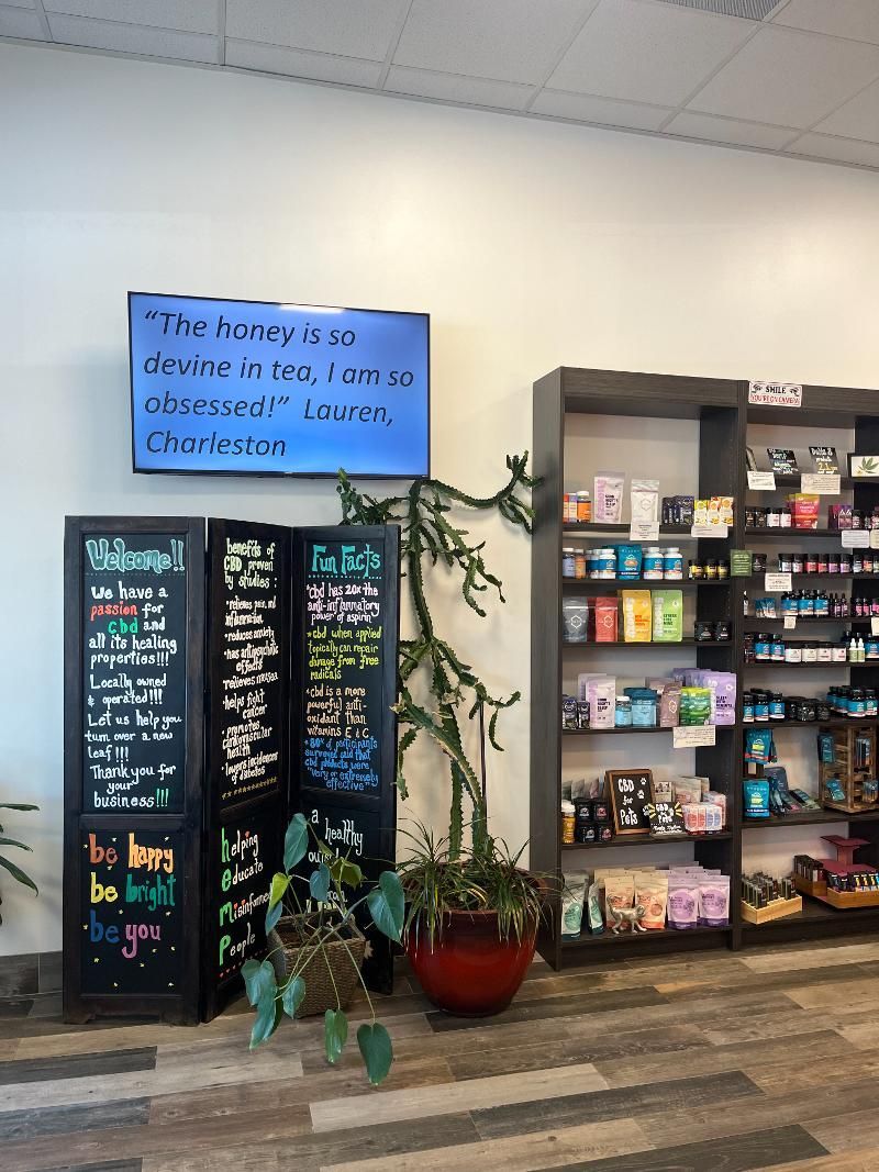 A store filled with lots of shelves and a sign on the wall.