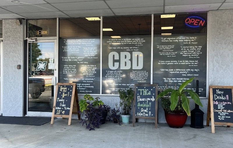 A store front with a sign that says cbd on it