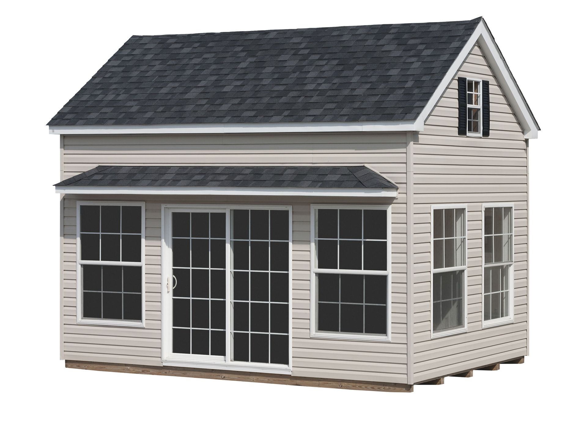 Light tan two-story shed with black roof, windows, and sliding glass door.