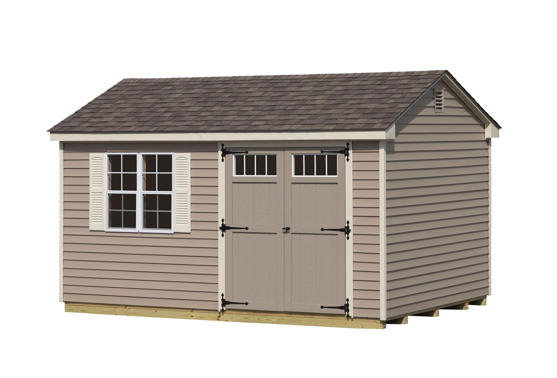 Tan shed with gray roof, double doors, window with shutters.