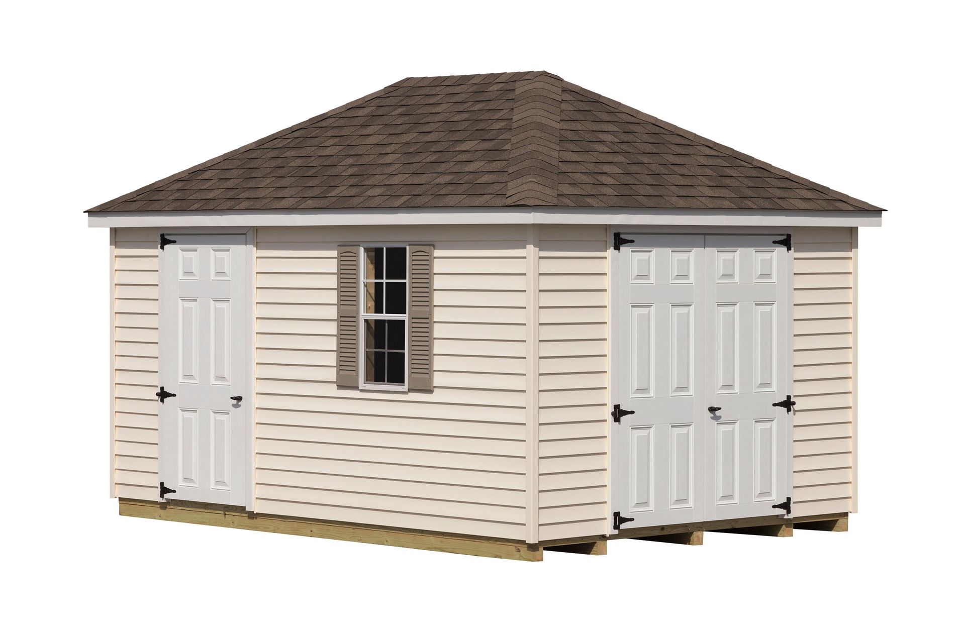 Tan shed with brown roof, white doors, and a small window.