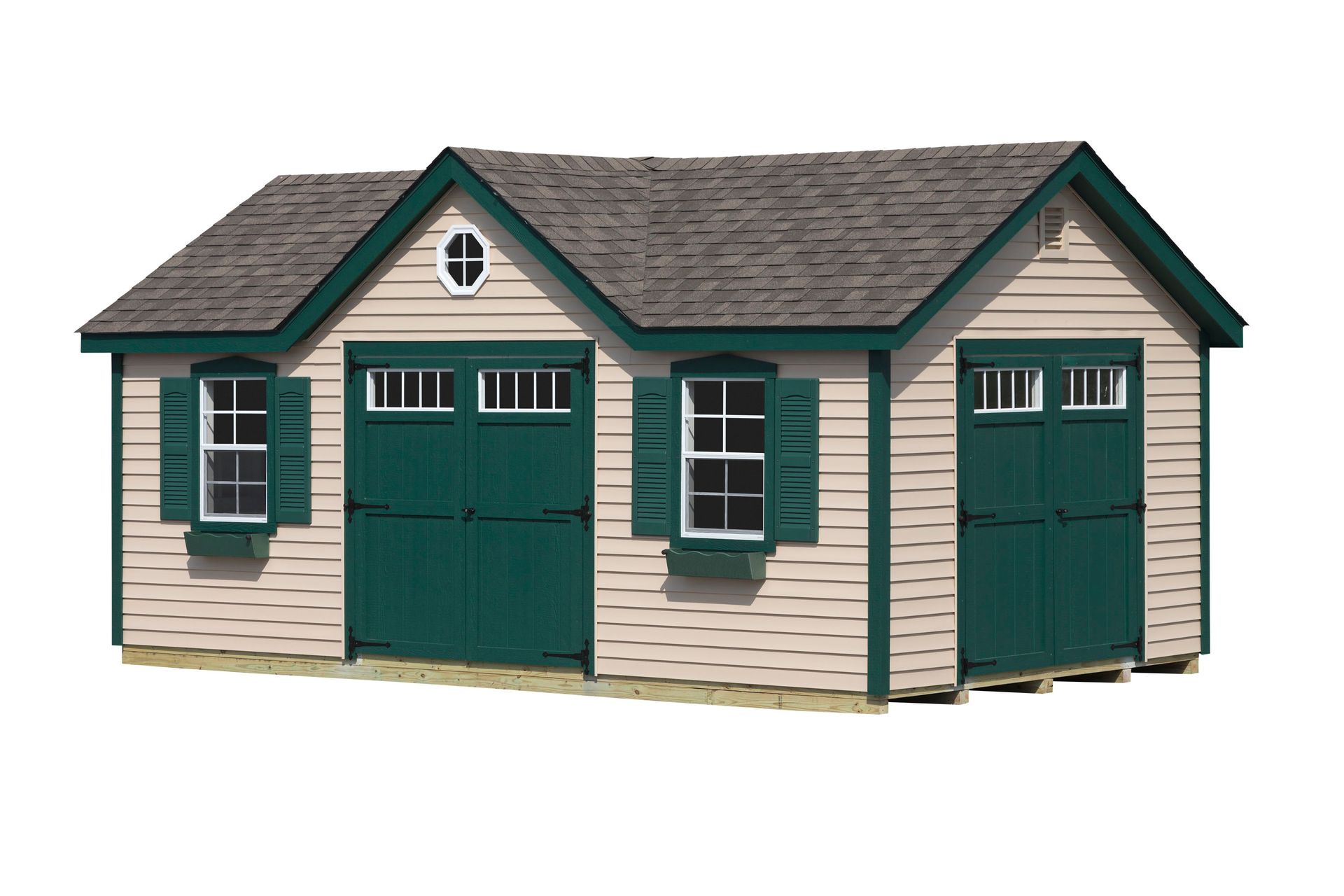 Tan and green shed with a gabled roof, shutters, and a small, round window.