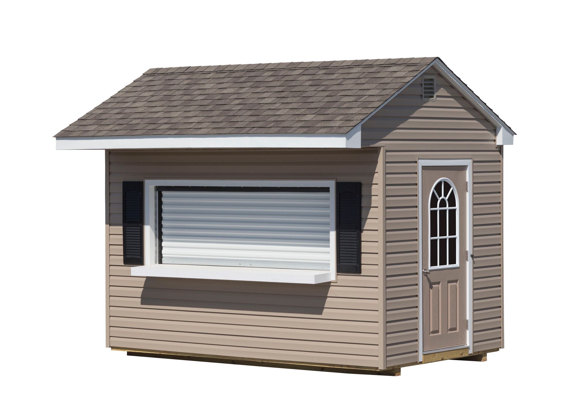 Tan, small shed with a window, door, and a brown shingled roof.