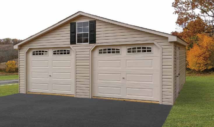 Tan two-car garage with a gable roof, small window, and light-colored doors on a black asphalt driveway.