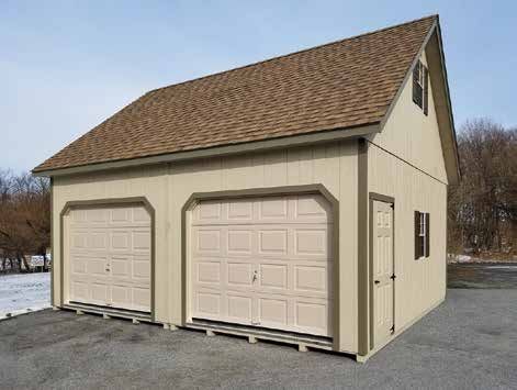 Two-car tan garage with brown roof, asphalt driveway, and snow in the background.