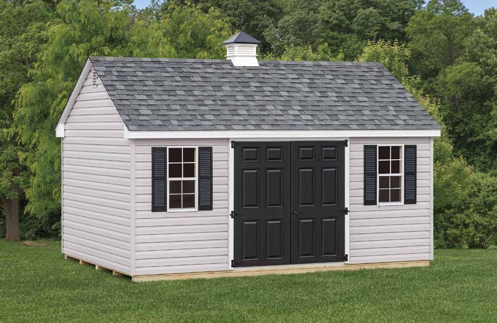 Gray and black storage shed with double doors, two windows, and a small cupola on the roof, set on grass.