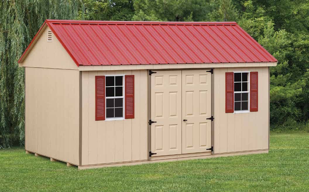Beige storage shed with red roof, shutters, and double doors, set in a grassy yard.