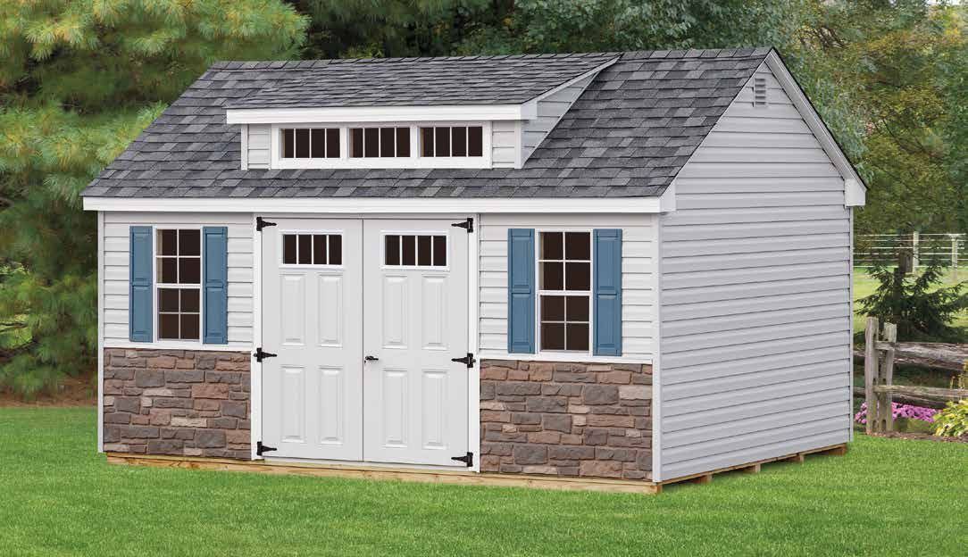 Gray and white shed with stone veneer base, blue shutters, and double doors; outdoors.