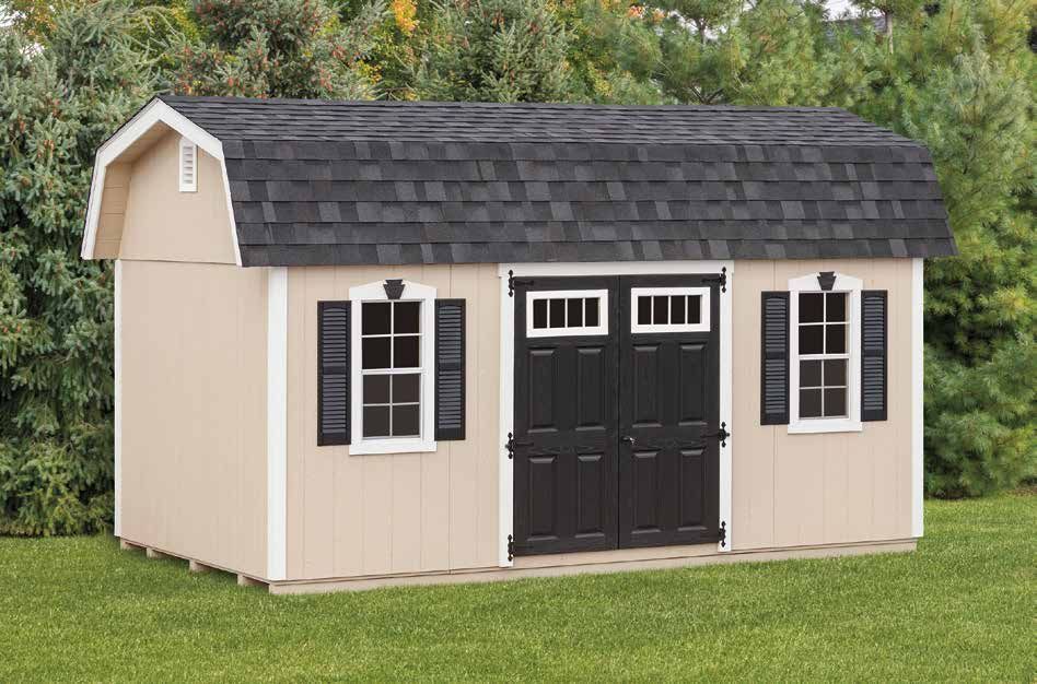Tan shed with black doors, shutters, and roof on a grassy lawn.