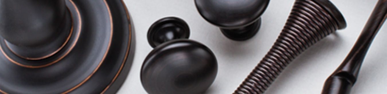 Black wooden gavels, a sound block, and scales on a light gray background.