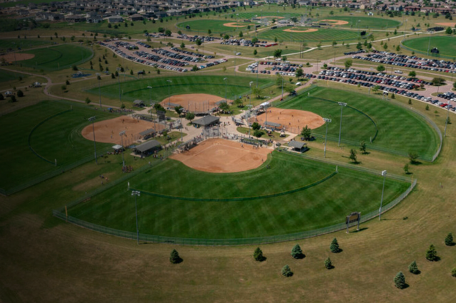 An aerial view of a baseball field in a park