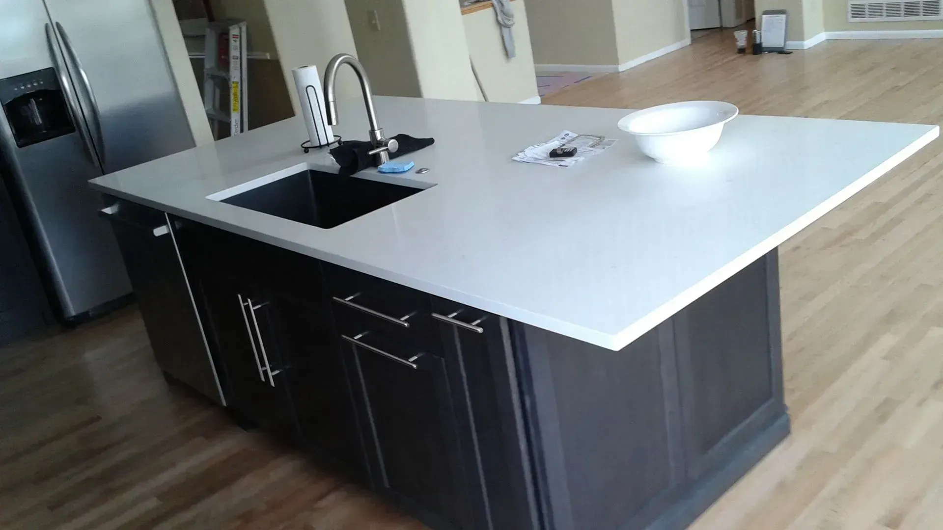 A kitchen with a large island and a sink