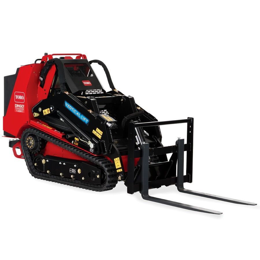 Red and black mini skid steer loader with forks on a white background