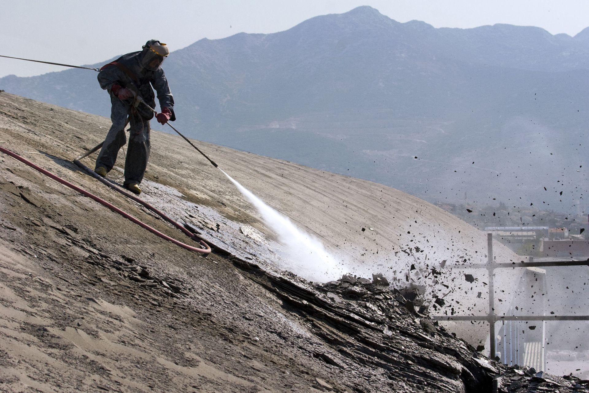 worker on top of factory hall