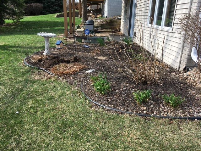 The house is surrounded by a lush green yard.
